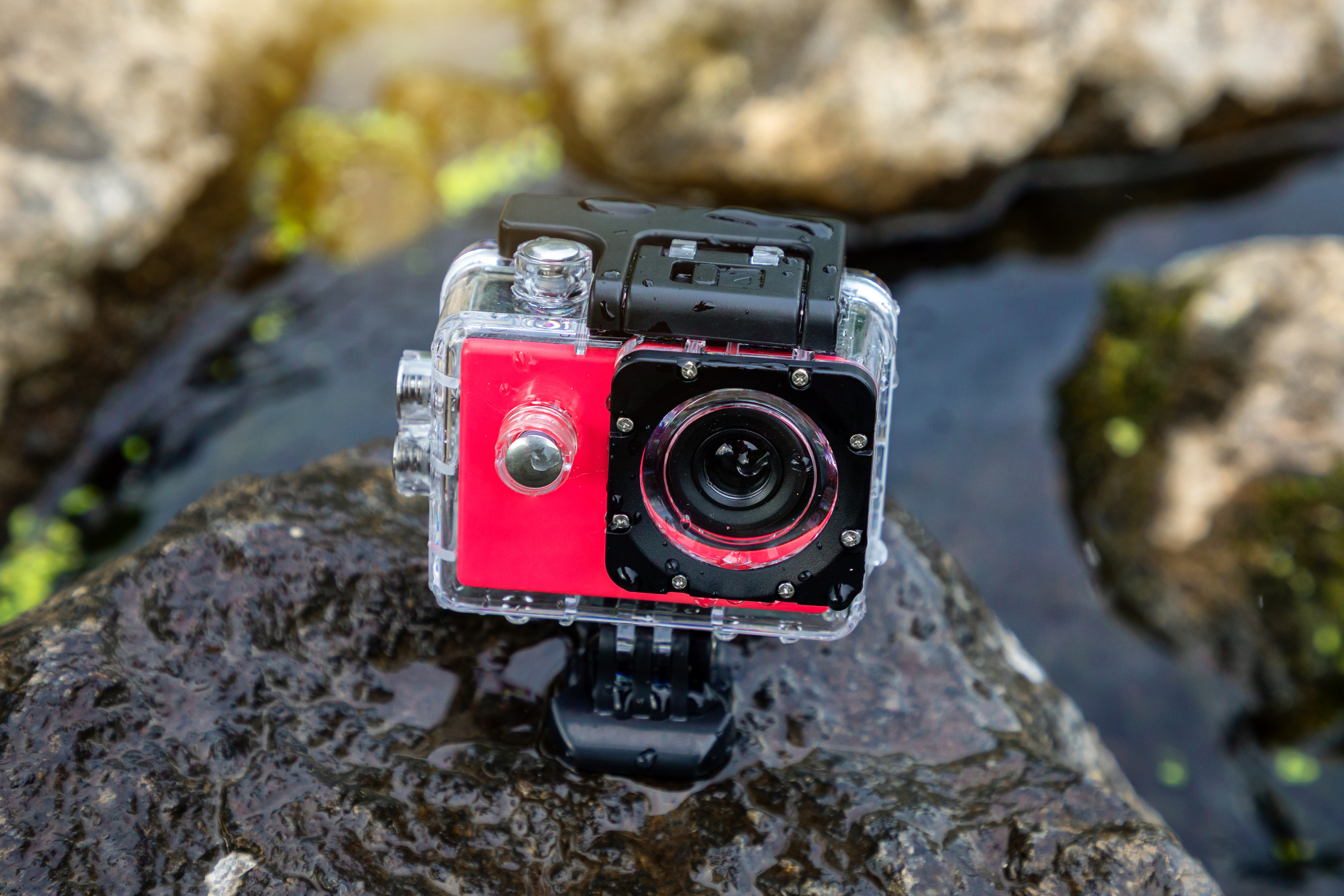 GoPro camera mounted on a rock