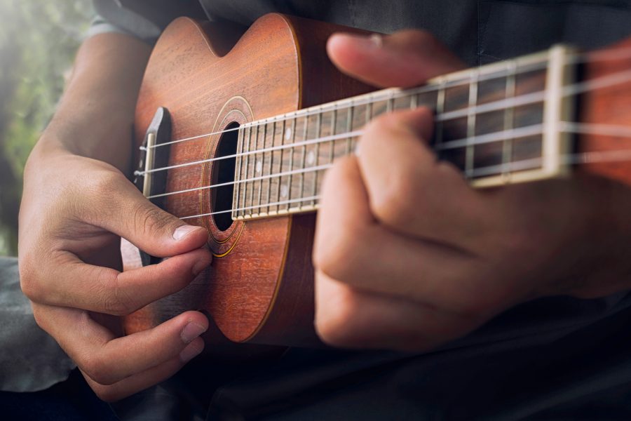 Person playing a ukulele